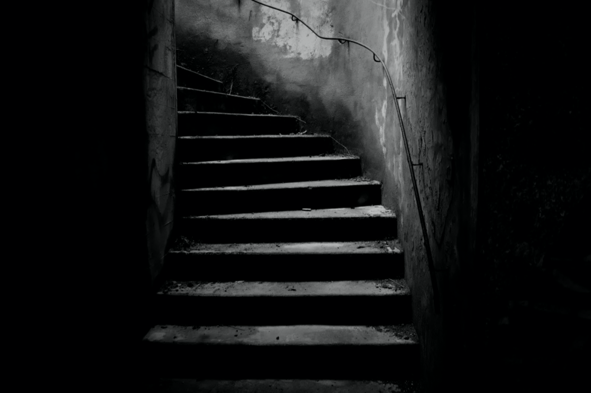 A dark staircase ascending into shadow