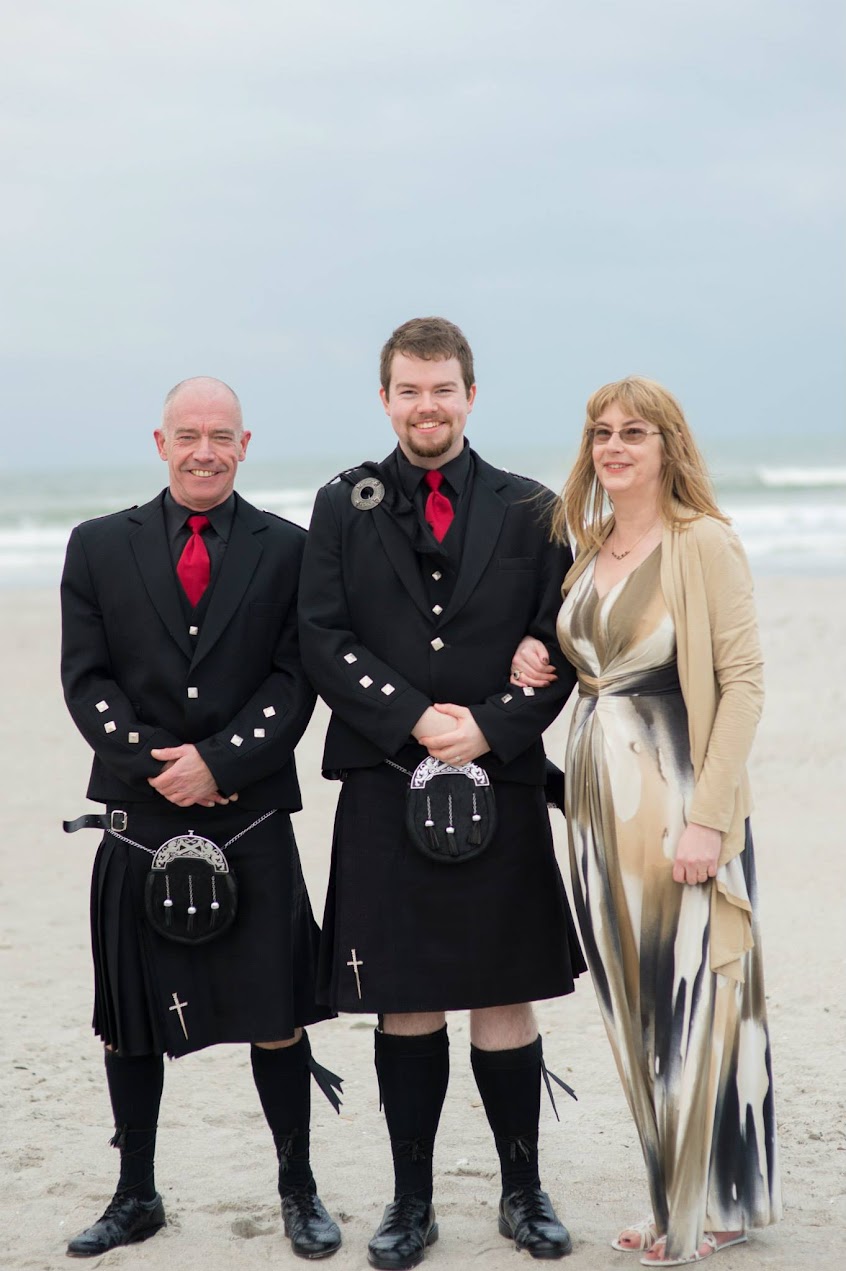 Ken with his parents wearing kilts