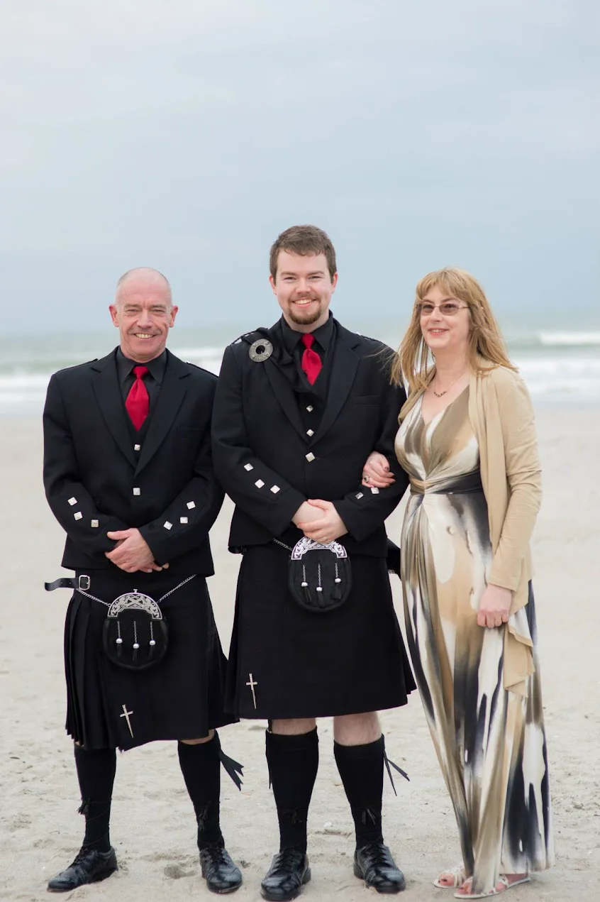 Ken with his parents wearing kilts