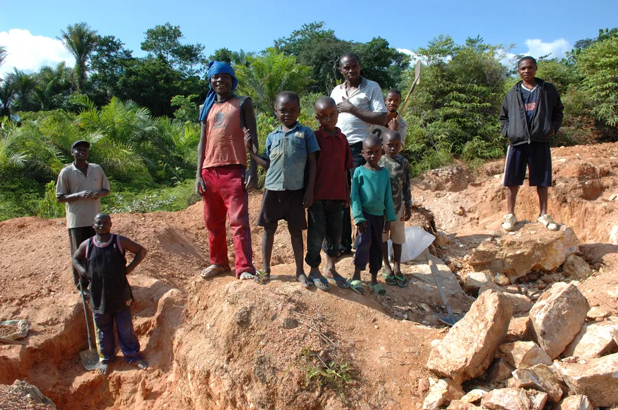 Children working alongside adults at an artisanal mining pit in Kailo, Democratic Republic of the Congo, 2007