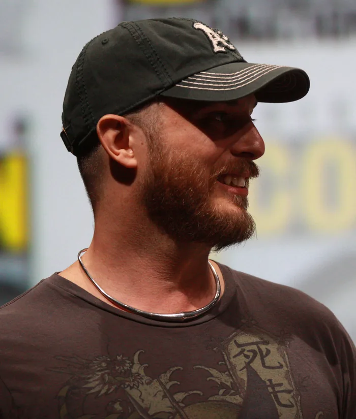 Duncan Jones in a cap, smiling, at San Diego Comic-Con