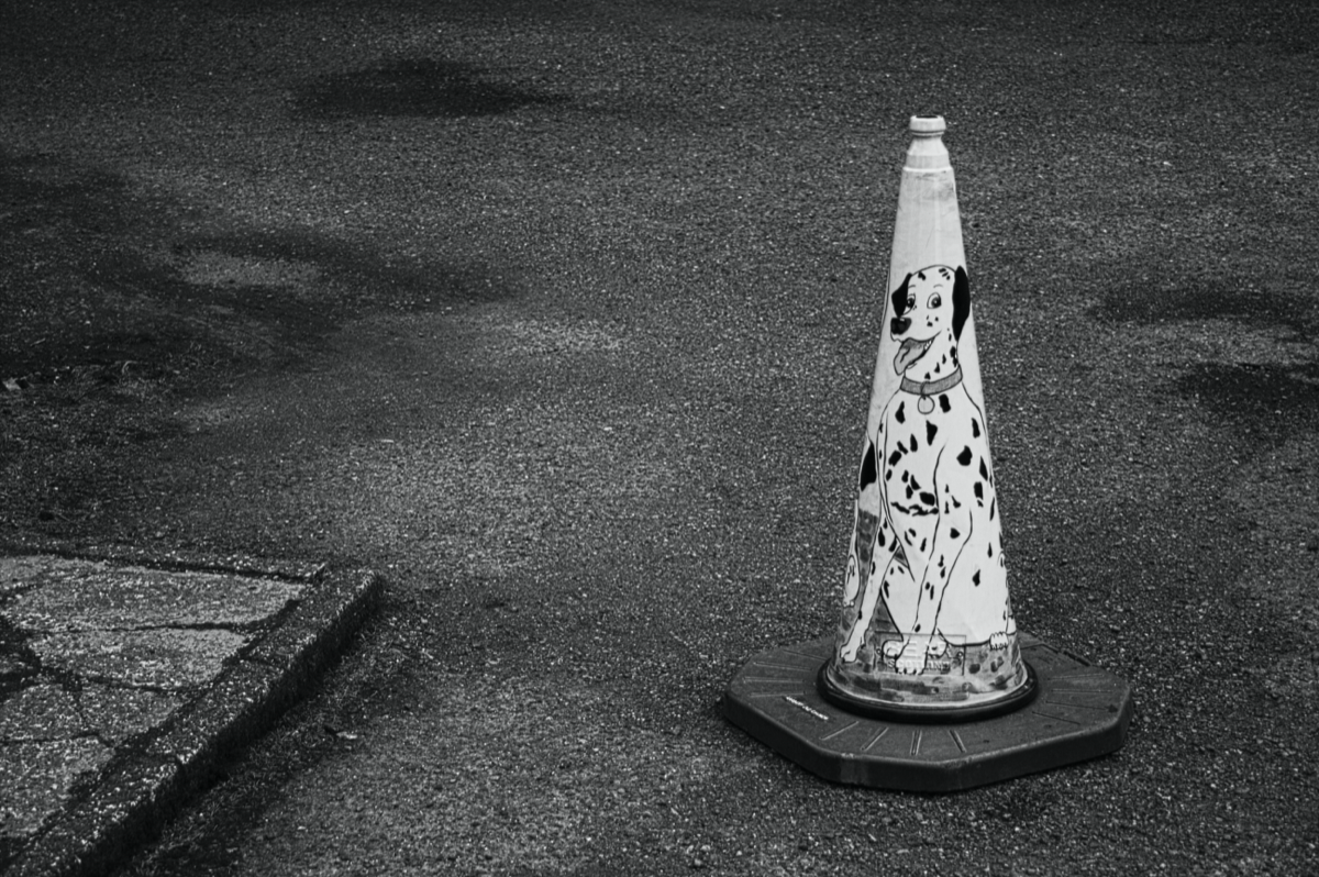 A traffic cone representing caution and prevention