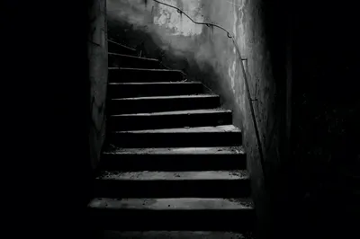 A dark staircase ascending into shadow