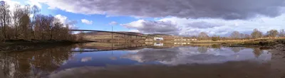 A photograph of Erskine, Scotland, the river running under a bridge next to the HP campus.