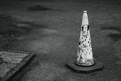 A traffic cone representing caution and prevention