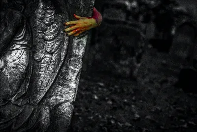 A hand on a grave.